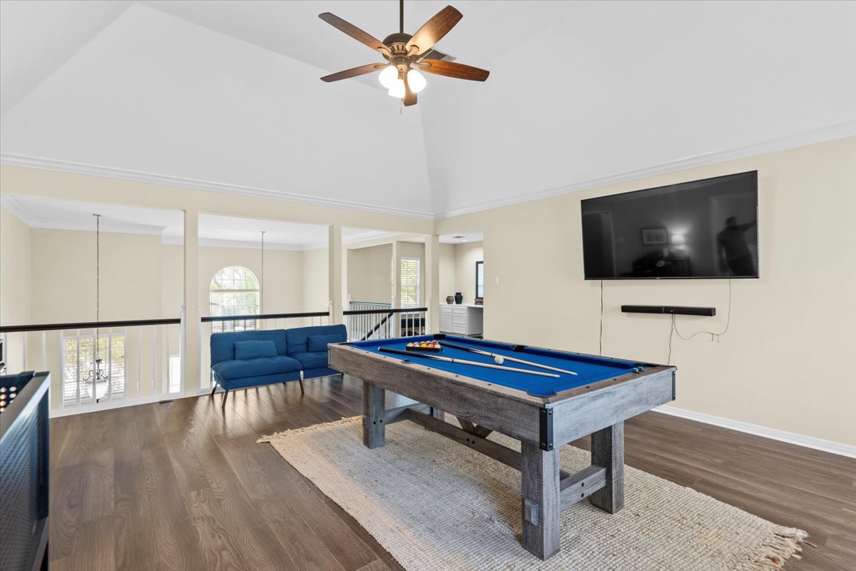 10116 Pinehurst Drive Austin, TX 78747 - Photo 16 of 37 Rec room featuring crown molding, high vaulted ceiling, pool table, dark wood-type flooring, and ceiling fan