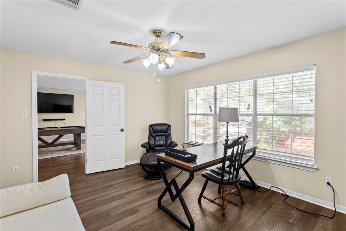 10116 Pinehurst Drive Austin, TX 78747 - Photo 18 of 37 Home office with wood finished floors and a ceiling fan