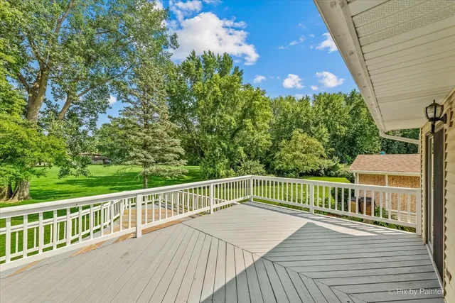 a view of a balcony with wooden floor