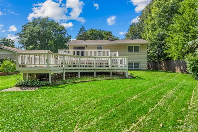 a view of a house with a backyard