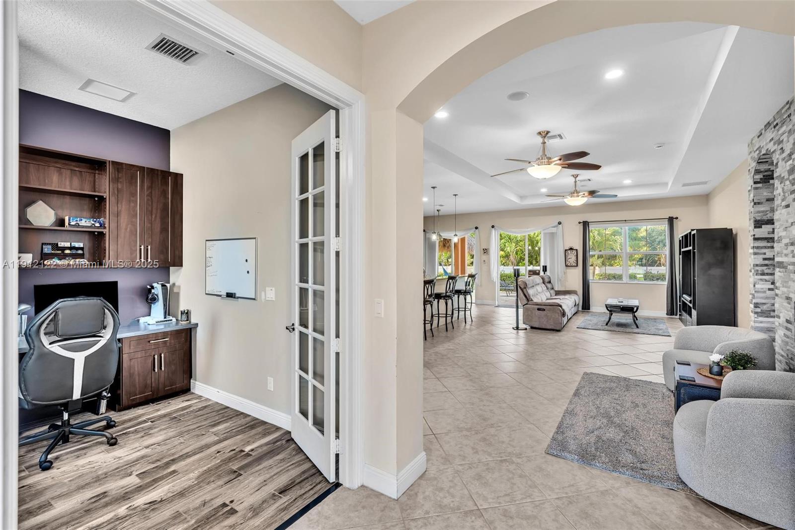 13220 Southwest 13th Street Davie, FL 33325 - Photo 16 of 65 a view of a livingroom with workspace and a window