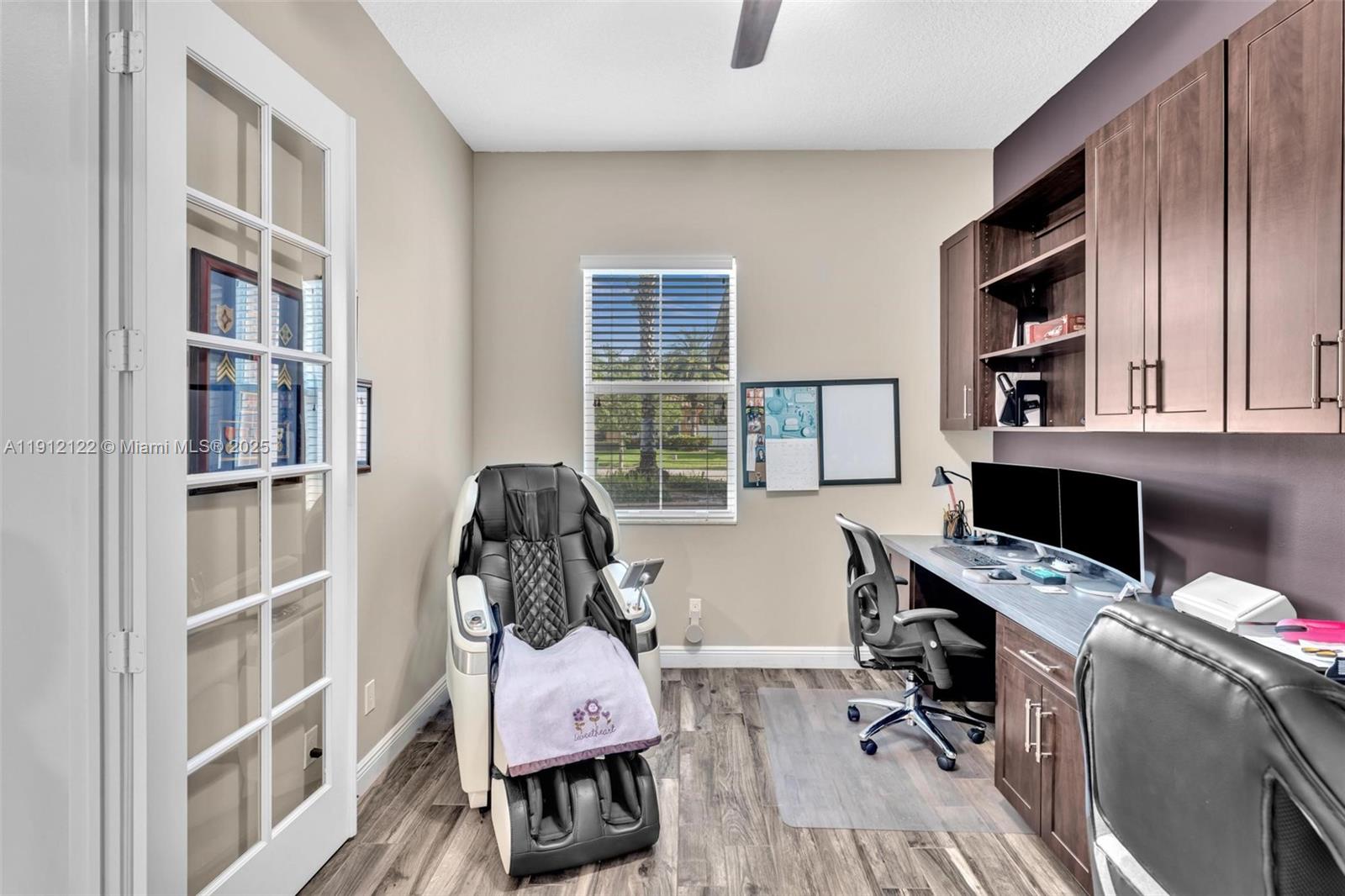 13220 Southwest 13th Street Davie, FL 33325 - Photo 17 of 65 a view of a workspace with furniture and a window
