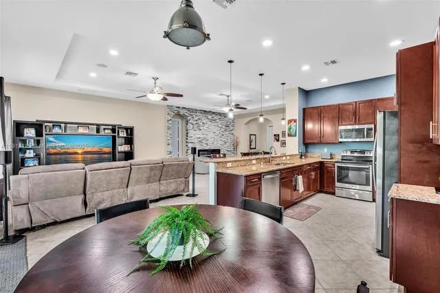 a bedroom with a bed and a television