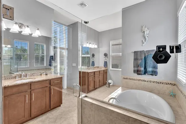 a view of a house with a yard patio and swimming pool