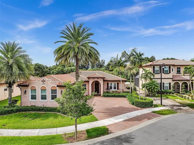 front view of a house with potted plants