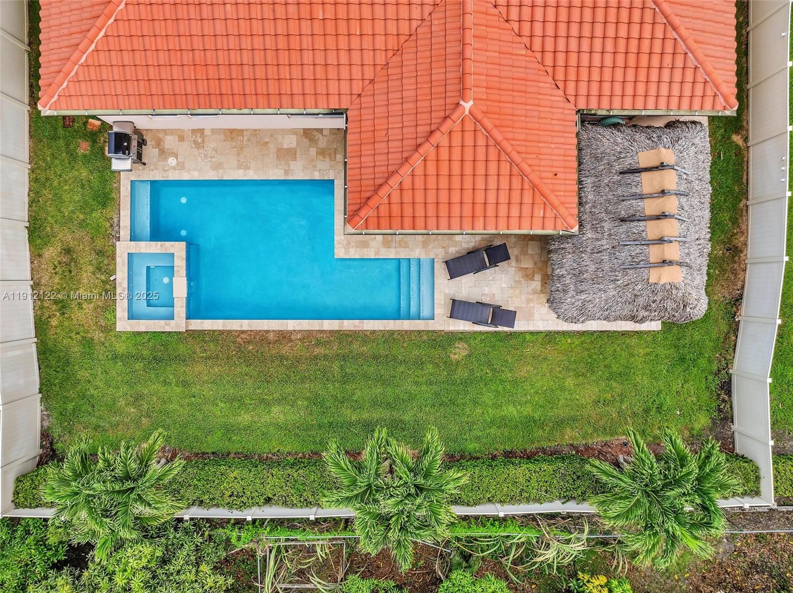 13220 Southwest 13th Street Davie, FL 33325 - Photo 63 of 65 a front view of a house with a garden