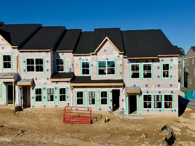 a front view of building with street