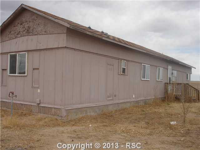 3315 Wiesner Road Calhan, CO 80808 - Photo 8 of 23 Bldg 2: This home has its own address, meter, septic, electricity, etc. As can be seen, a lot of exterior work needs to be done. Don't miss the inside.