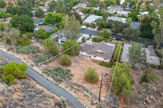 an aerial view of a house with a garden view