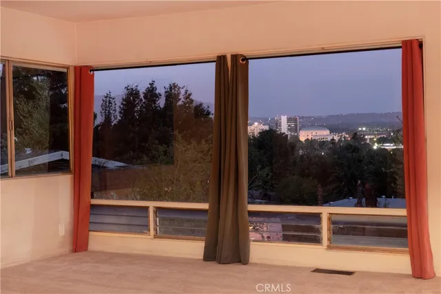 a view of a door and a mirror