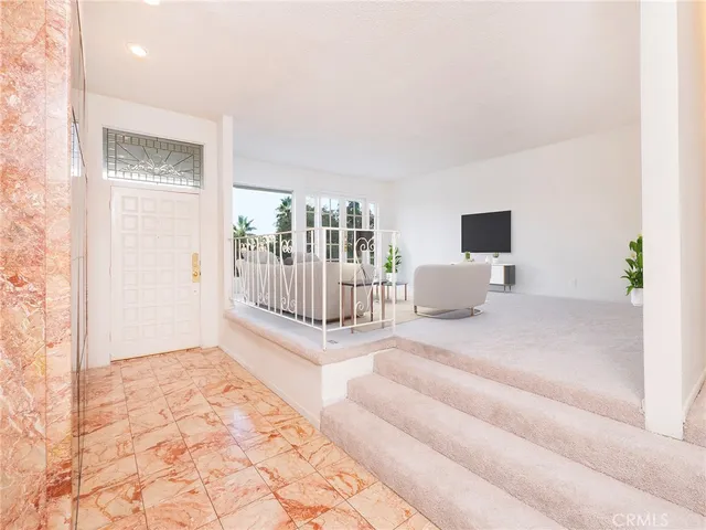 a view of livingroom with furniture and windows