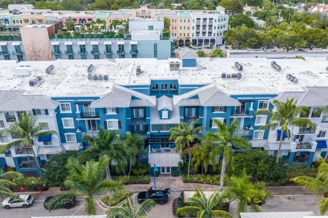 a view of multiple houses with a yard