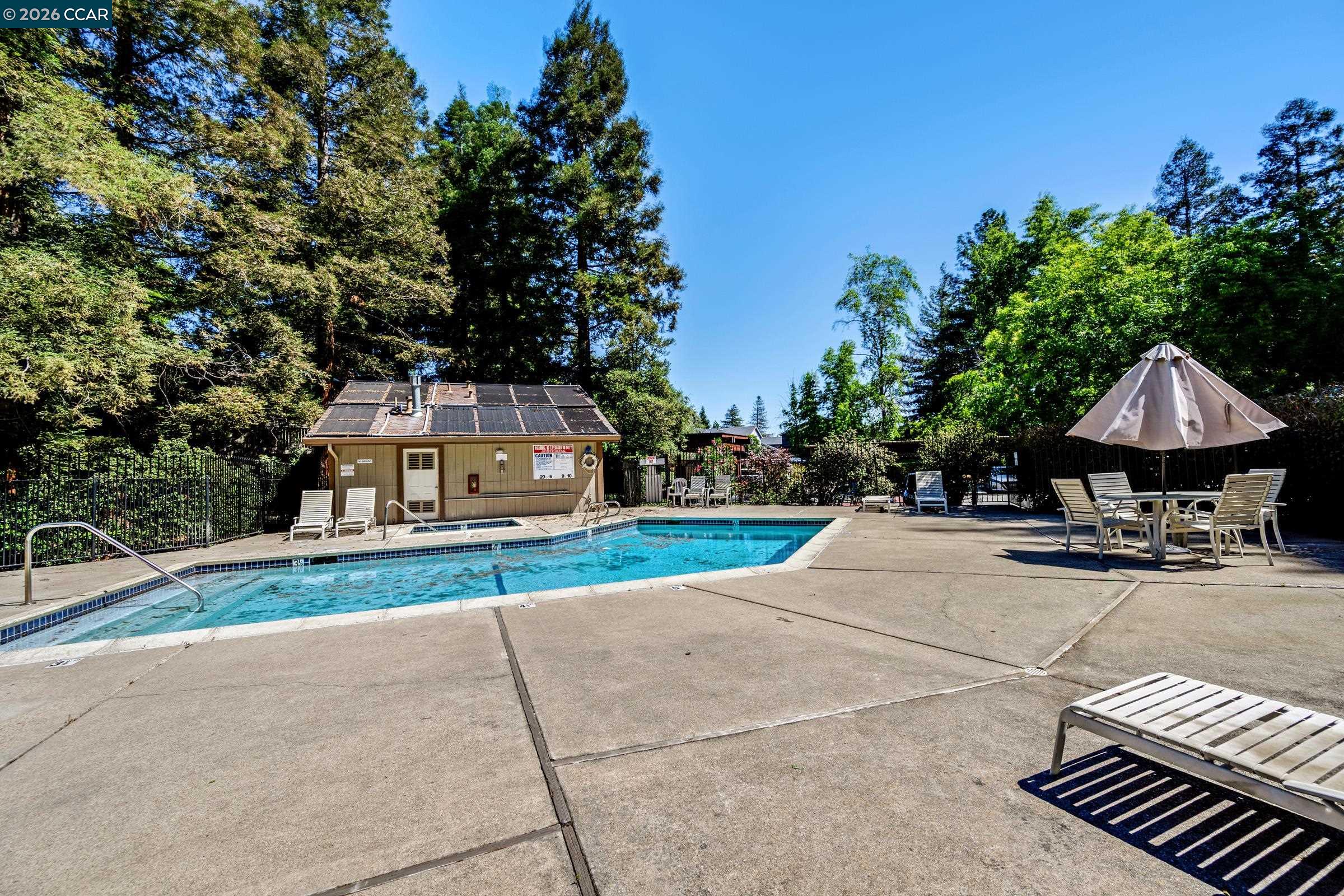 1544 Bailey Road, Unit 30 Concord, CA 94521 - Photo 28 of 33 a view of a house with wooden fence