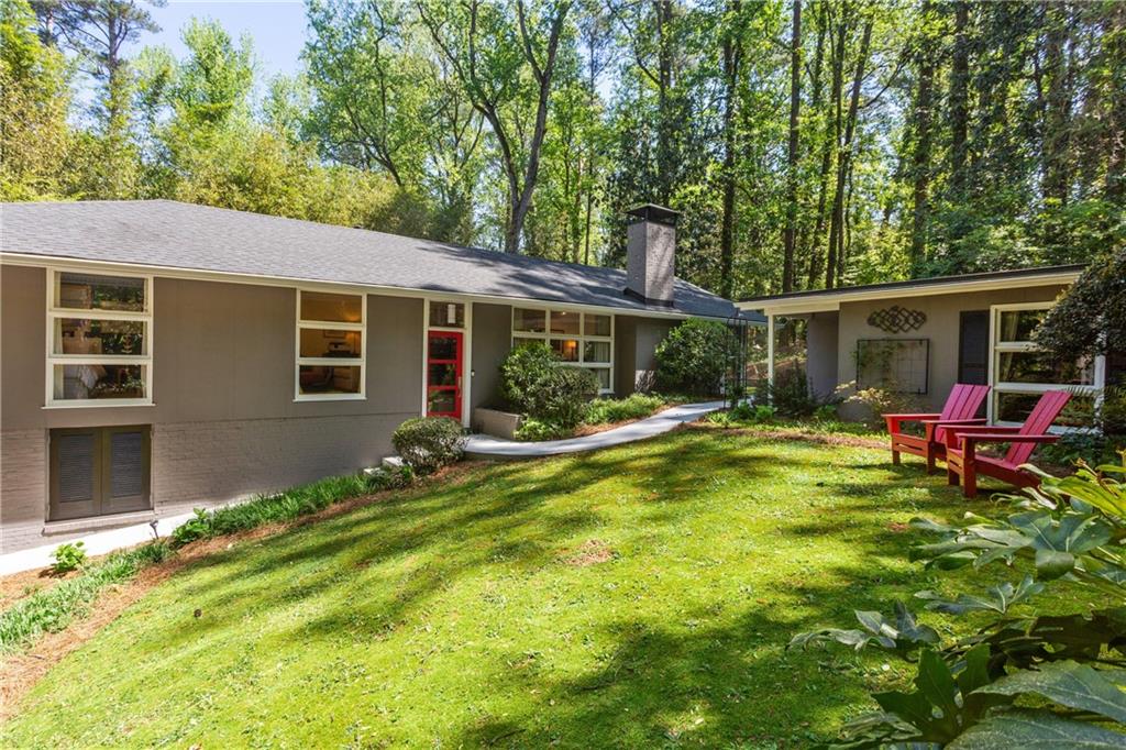 1091 McConnell Drive Decatur, GA 30033 - Photo 1 of 1 a front view of house with yard patio and green space