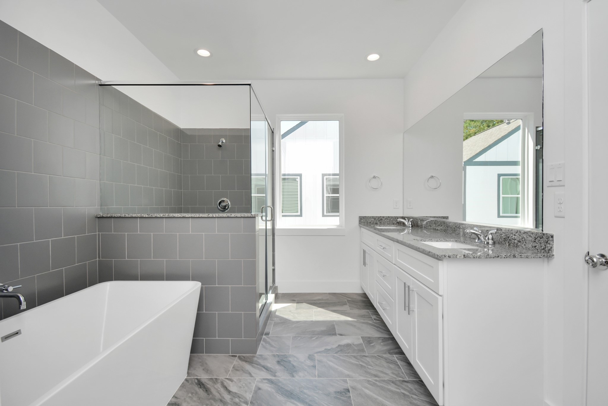 420 Janisch Road, Unit B Houston, TX 77018 - Photo 19 of 24 a bathroom with a granite countertop bathtub sink vanity and toilet