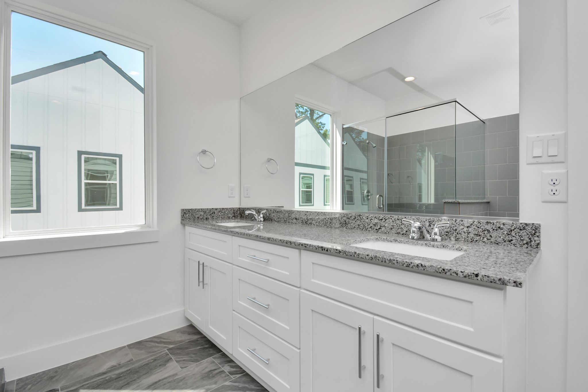 420 Janisch Road, Unit B Houston, TX 77018 - Photo 21 of 24 a bathroom with a granite countertop sink double and mirror