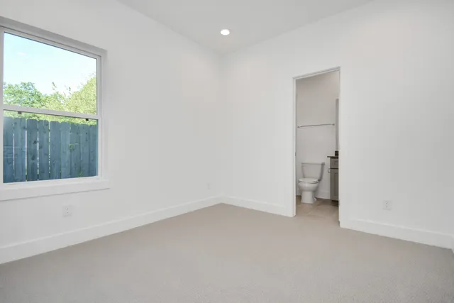 a view of a room with a closet and a window