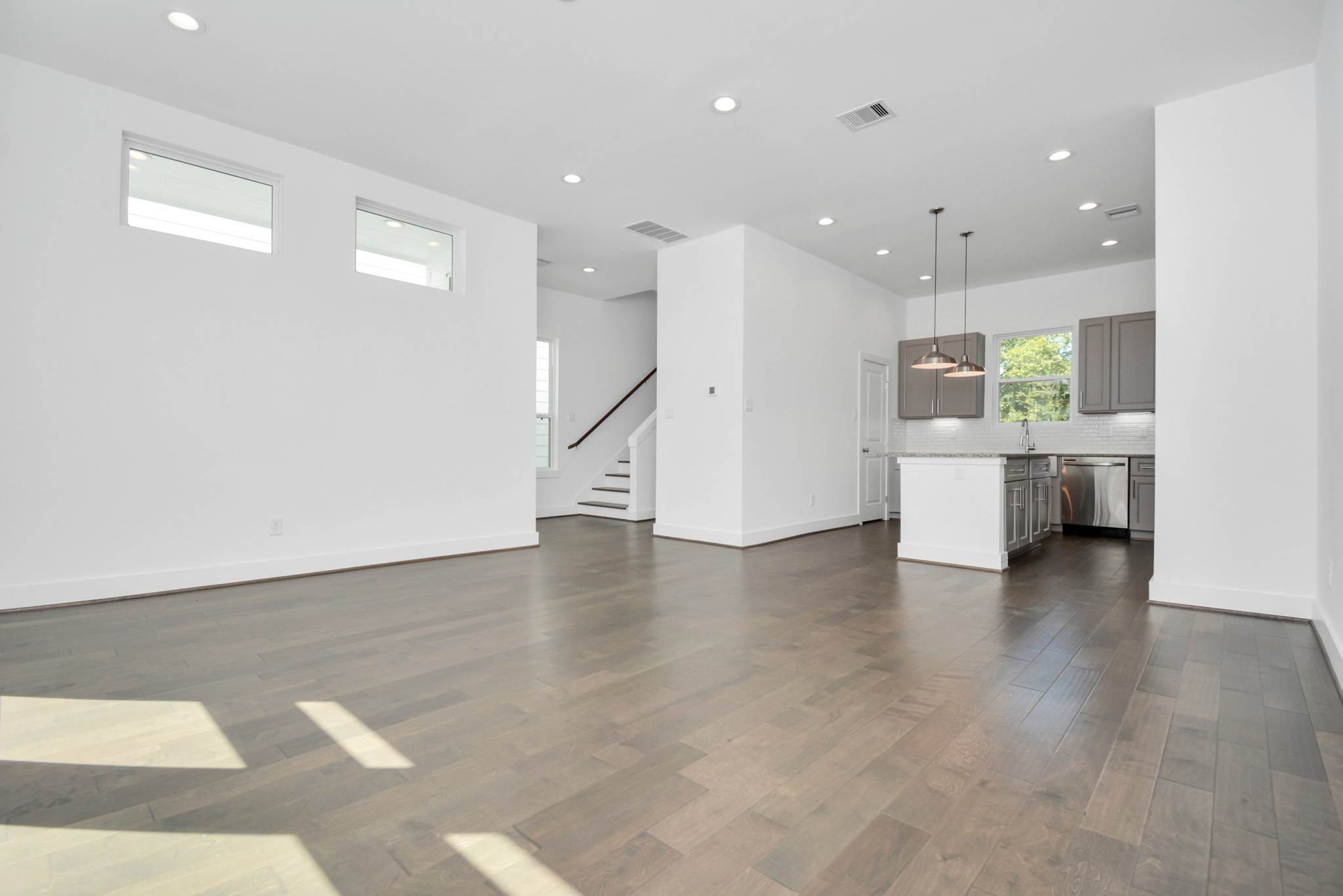 420 Janisch Road, Unit B Houston, TX 77018 - Photo 6 of 24 a view of a big room with wooden floor and windows