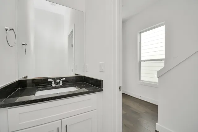 a bathroom with a sink and a window