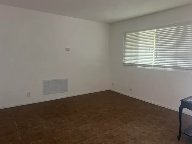 a kitchen with a sink and a stove top oven