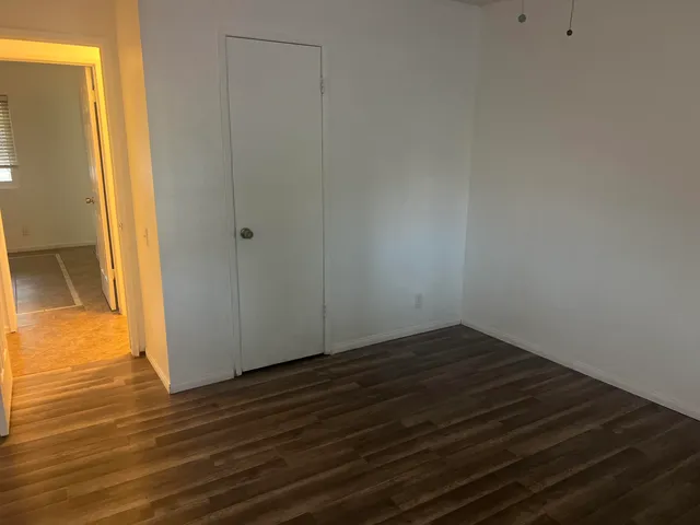 a view of a porch with furniture and garden