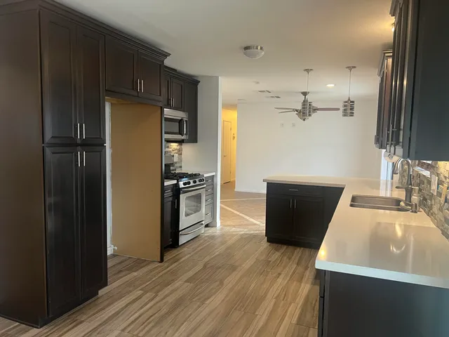 a view of a porch with furniture and a yard