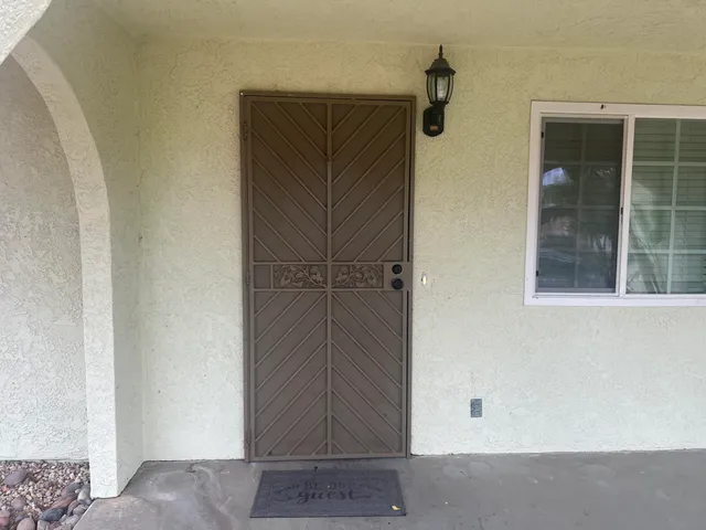 a view of a room with wooden floor and windows
