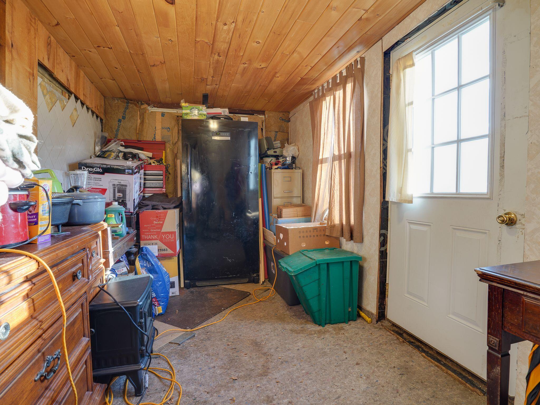 23 Front Street Tupper Lake, NY 12986 - Photo 8 of 13 Back inside porch
