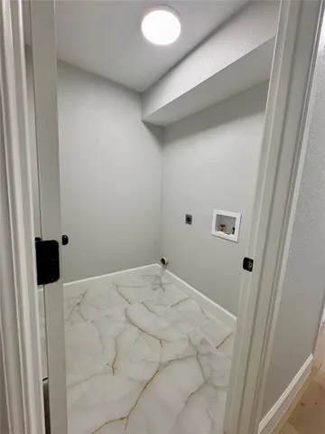 a bathroom with a sink a toilet a mirror and bathtub