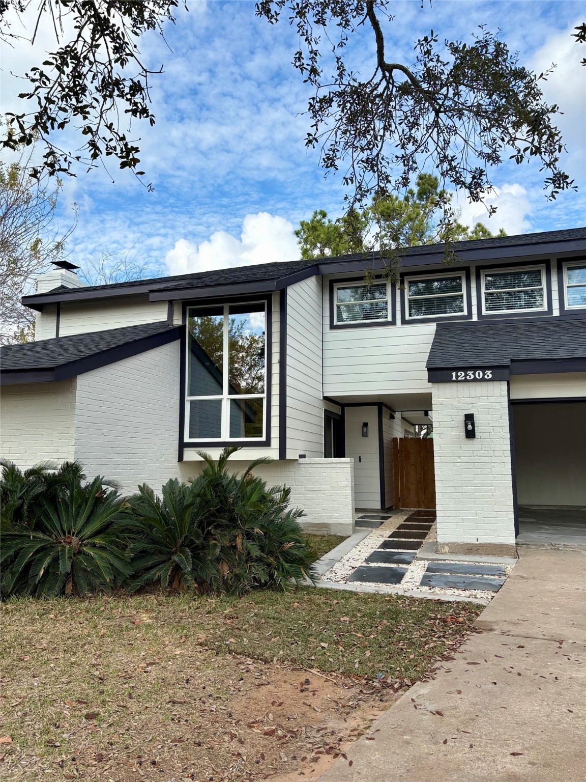 12303 Split Rail Lane Houston, TX 77071 - Photo 6 of 50 Fresh paint, modern fixtures, and precision craftsmanship showcase the complete transformation of this home’s exterior.