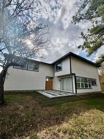 a house with garden in front of it