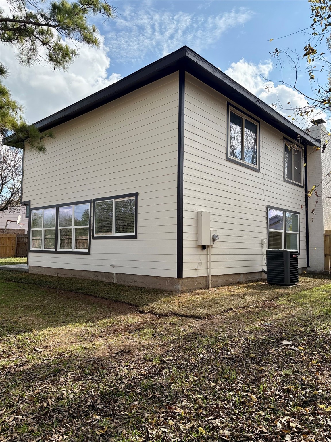 12303 Split Rail Lane Houston, TX 77071 - Photo 10 of 50 Newly installed siding and freshly painted fascia boards extend around the entire home, adding both durability and a clean, modern finish.