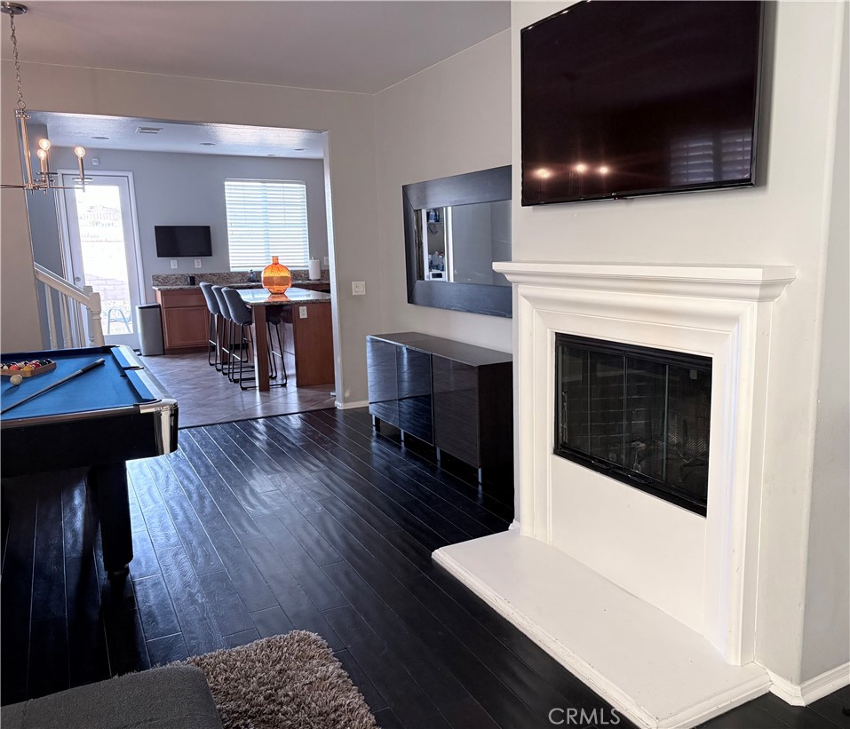 2729 Hornbeam Road Palmdale, CA 93551 - Photo 21 of 35 a living room with furniture and a fireplace