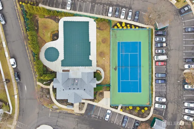 a front view of a house with outdoor seating and a potted plant