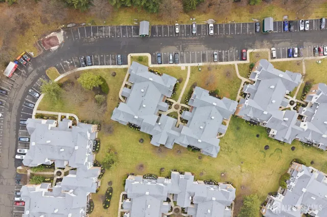 an aerial view of residential house with outdoor space and swimming pool