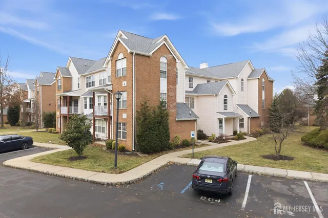 a car parked in front of a brick house