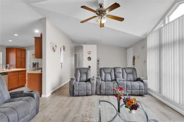 a view of a dining room with furniture and a window