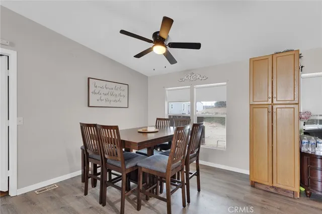 a kitchen with stainless steel appliances a refrigerator sink and cabinets