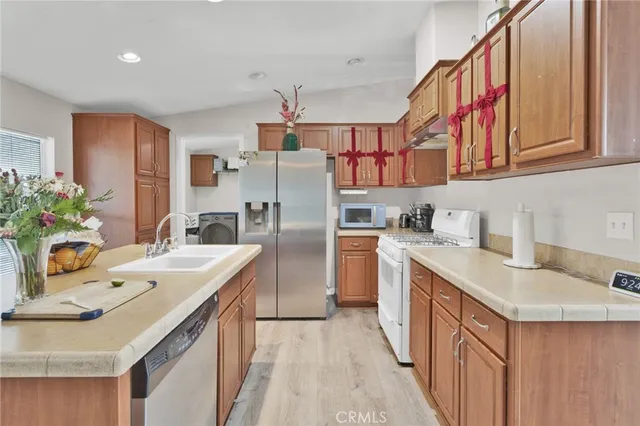 a view of a kitchen center island and living room
