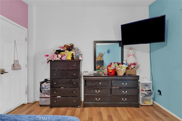 a bathroom with a granite countertop toilet sink and mirror