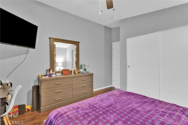 a bedroom with bed and a chandelier