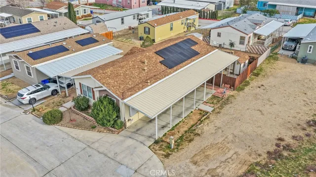 an aerial view of a house with a outdoor space