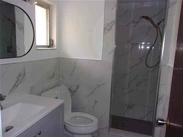 a bathroom with a toilet and a sink