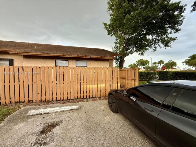 a view of a car park in front of a building
