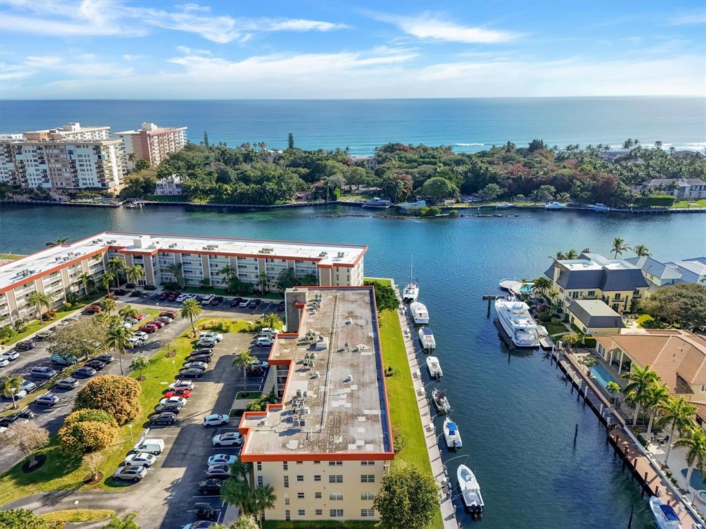 3050 Northeast 48th Court Lighthouse Point, FL 33064 - Photo 1 of 25 an aerial view of a house with a lake view