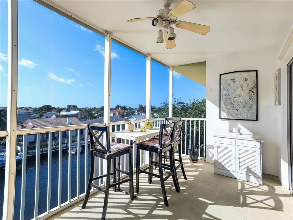 3050 Northeast 48th Court Lighthouse Point, FL 33064 - Photo 11 of 25 a view of a balcony with furniture