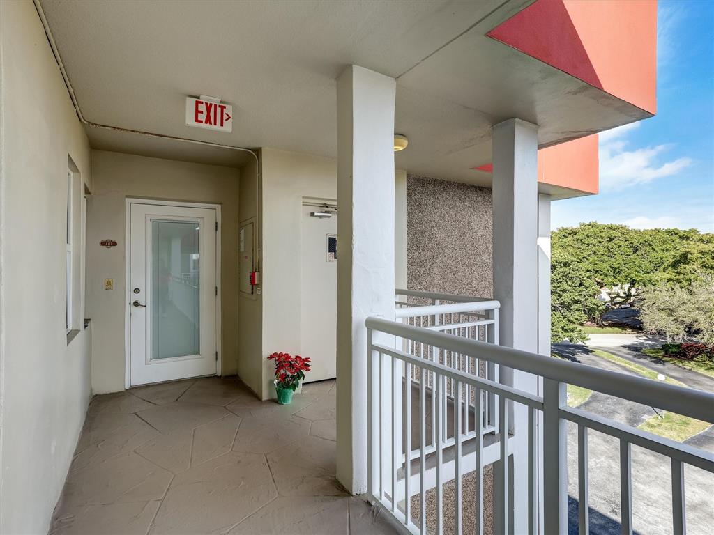 3050 Northeast 48th Court Lighthouse Point, FL 33064 - Photo 2 of 25 a view of a porch with furniture