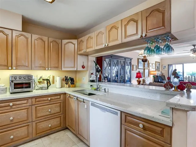 a kitchen with stainless steel appliances granite countertop a sink and cabinets