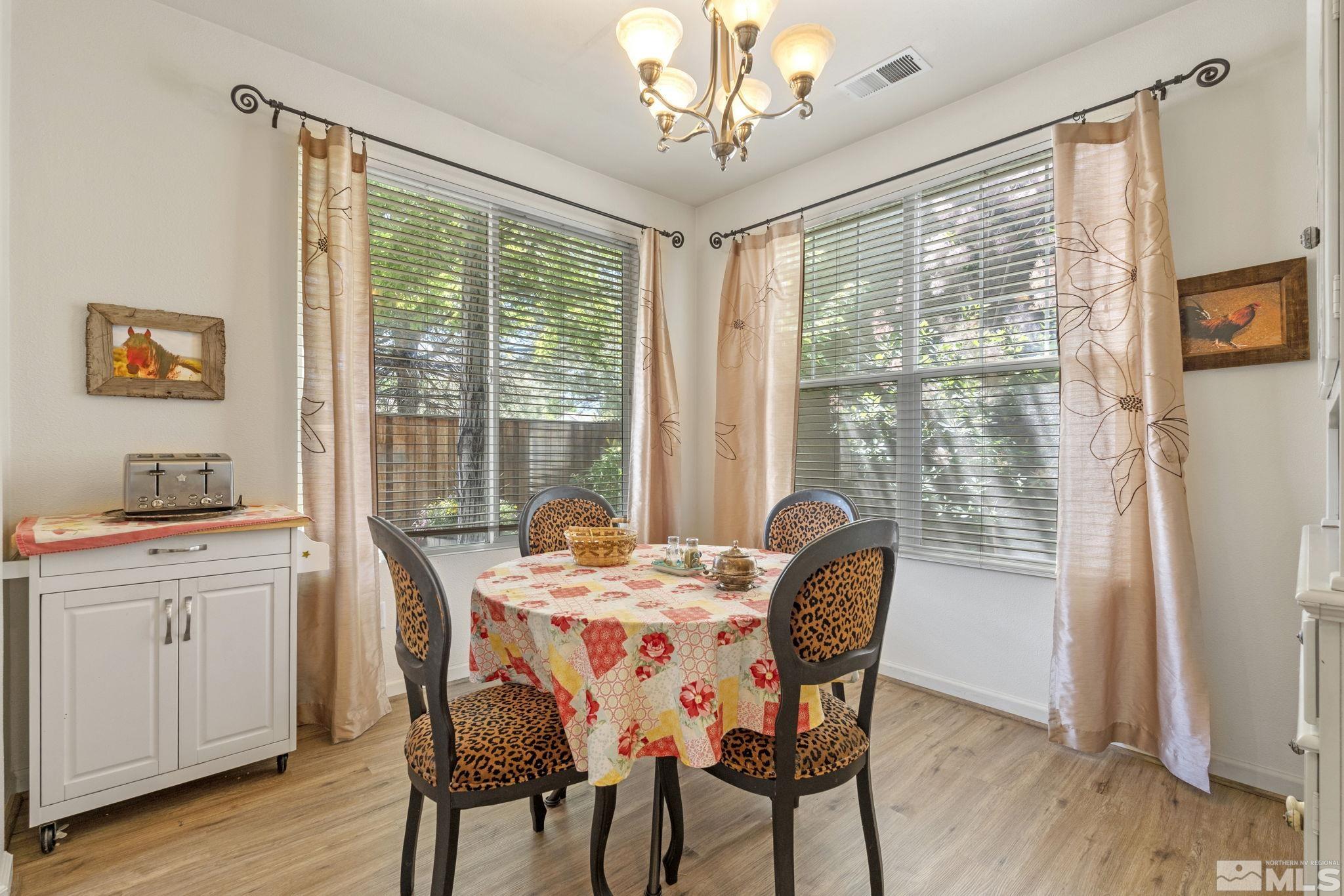 10465 Summershade Lane Reno, NV 89521 - Photo 16 of 30 a dining room with furniture window wooden floor