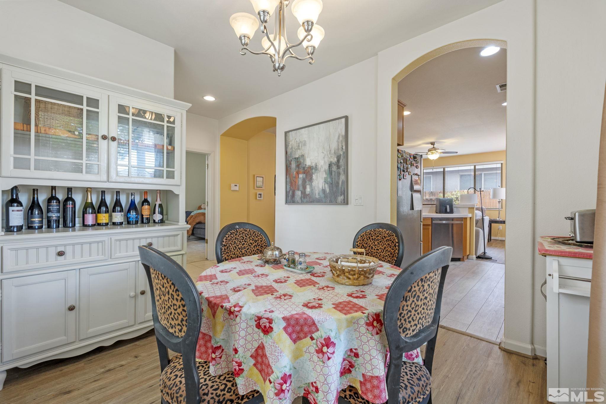 10465 Summershade Lane Reno, NV 89521 - Photo 19 of 30 a dining room with furniture and wooden floor